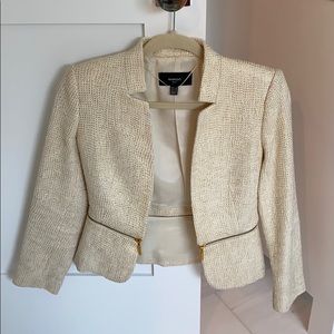 White blazer with gold details and zipper
